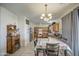 Traditional eat-in kitchen with wood cabinets, neutral countertops, tile floor and standard appliances at 703 N Redwood Ln, Buckeye, AZ 85326