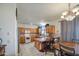 Eat-in kitchen featuring wooden cabinets, an island with seating, and tile flooring at 703 N Redwood Ln, Buckeye, AZ 85326