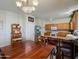Bright kitchen and dining area with wood cabinets, stainless steel appliances, and a ceiling fan at 703 N Redwood Ln, Buckeye, AZ 85326