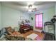 Living room showcasing a piano, a ceiling fan, and natural lighting at 703 N Redwood Ln, Buckeye, AZ 85326