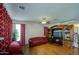 Spacious living room featuring hardwood floors, and a ceiling fan at 703 N Redwood Ln, Buckeye, AZ 85326