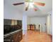 Bonus room featuring hardwood floors and a large television console at 703 N Redwood Ln, Buckeye, AZ 85326