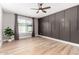 Bedroom features include vinyl flooring, ceiling fan, backyard view, and an accent wall at 7232 W Sunnyside Dr, Peoria, AZ 85345