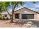 Inviting single-story home featuring a well-maintained yard and a two car garage at 7232 W Sunnyside Dr, Peoria, AZ 85345