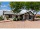 Inviting single-story home with mature trees, manicured landscaping and a two car garage at 7232 W Sunnyside Dr, Peoria, AZ 85345