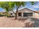 Charming single-story home featuring a well-maintained yard and a two car garage at 7232 W Sunnyside Dr, Peoria, AZ 85345