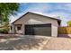 Single-story home featuring a two-car garage and low-maintenance landscaping at 7232 W Sunnyside Dr, Peoria, AZ 85345