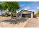 Charming single-story home featuring a well-maintained yard and a two car garage at 7232 W Sunnyside Dr, Peoria, AZ 85345