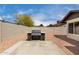Grill with a marble-look base, surrounded by gravel and a block wall at 7232 W Sunnyside Dr, Peoria, AZ 85345