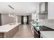 A modern kitchen featuring white cabinets, a central island, stainless steel appliances, and recessed lighting at 7232 W Sunnyside Dr, Peoria, AZ 85345