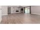 Open-concept living room featuring modern tile floors, marble fireplace, and sliding glass doors at 7232 W Sunnyside Dr, Peoria, AZ 85345