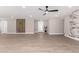 Open-concept living room featuring modern tile floors, marble fireplace, and plenty of space at 7232 W Sunnyside Dr, Peoria, AZ 85345