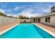 Backyard pool surrounded by gravel, next to a covered patio and a gazebo on a sunny day at 7232 W Sunnyside Dr, Peoria, AZ 85345