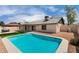 Backyard pool view showcasing the home's exterior, gazebo and the surrounding desert landscape at 7232 W Sunnyside Dr, Peoria, AZ 85345