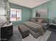 Tranquil bedroom with a comfortable bed, dresser, and natural light at 750 E Northern Ave # 2088, Phoenix, AZ 85020