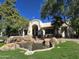 Stunning clubhouse with a charming water feature and lush green landscaping at 750 E Northern Ave # 2088, Phoenix, AZ 85020