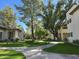 Beautifully landscaped grounds and well-maintained building exterior with mature trees at 750 E Northern Ave # 2088, Phoenix, AZ 85020