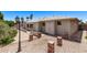 Private backyard featuring a desert landscape, patio, and rustic brick pillars, creating a cozy outdoor retreat at 7904 E Madero Ave, Mesa, AZ 85209