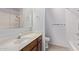 Bathroom featuring a vanity with wooden drawers and a shower with white tile at 7904 E Madero Ave, Mesa, AZ 85209
