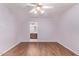 Inviting bedroom with laminate flooring and an attached bathroom at 7904 E Madero Ave, Mesa, AZ 85209
