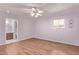 Comfortable bedroom featuring laminate flooring and ample natural light at 7904 E Madero Ave, Mesa, AZ 85209