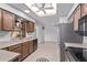 Well-equipped kitchen with modern appliances and tile flooring throughout at 7904 E Madero Ave, Mesa, AZ 85209