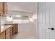 Laundry room with upper cabinets, tiled floor, and a window at 7904 E Madero Ave, Mesa, AZ 85209