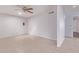 Bright living room with ceiling fan and neutral tile flooring at 7904 E Madero Ave, Mesa, AZ 85209