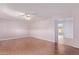 Spacious living room featuring a ceiling fan, laminate flooring and neutral wall color at 7904 E Madero Ave, Mesa, AZ 85209
