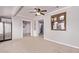 Living room with tile floors, neutral colors, ceiling fan, and open layout at 7904 E Madero Ave, Mesa, AZ 85209