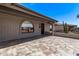 Tile-covered patio area with desert landscaping, gray brick accents and covered front entry at 7904 E Madero Ave, Mesa, AZ 85209
