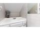 Cozy bathroom features a white vanity and a brick wall with a mirror above the sink at 7915 E Keim Dr, Scottsdale, AZ 85250