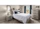 Comfortable bedroom with a large window providing natural light and a wood-accented headboard at 7915 E Keim Dr, Scottsdale, AZ 85250