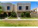 Charming two-story townhouse with lush landscaping and a well-manicured lawn at 7915 E Keim Dr, Scottsdale, AZ 85250
