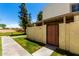 Well-maintained home exterior with a gated entrance, lush lawn and manicured landscaping at 7915 E Keim Dr, Scottsdale, AZ 85250