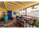 Charming outdoor patio with unique decor, comfortable seating and colorful rug at 7915 E Keim Dr, Scottsdale, AZ 85250