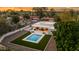Stunning aerial view of the backyard with a pool, patio, and lush landscaping at 8501 E Appaloosa Trl, Scottsdale, AZ 85258