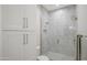 Elegant bathroom showcases a glass shower, white cabinets, and modern gold fixtures at 8501 E Appaloosa Trl, Scottsdale, AZ 85258