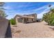 Backyard featuring a beige home exterior with gravel at 8737 E Nichols Ave, Mesa, AZ 85209
