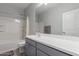 Bathroom with white vanity, bathtub, and shower with curtain at 8737 E Nichols Ave, Mesa, AZ 85209