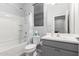 This bathroom has a shower-tub combination and a large vanity with sink at 8737 E Nichols Ave, Mesa, AZ 85209