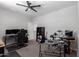 Bedroom featuring musical instruments, neutral walls, ceiling fan, and carpet at 8737 E Nichols Ave, Mesa, AZ 85209