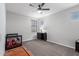 This bedroom is painted in neutral colors and has carpeted floors at 8737 E Nichols Ave, Mesa, AZ 85209