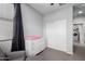 Neutral Bedroom offers a serene space with a plush glider and ample storage at 8737 E Nichols Ave, Mesa, AZ 85209