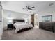 This main bedroom boasts a barn door to the main bathroom and neutral decor at 8737 E Nichols Ave, Mesa, AZ 85209