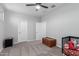 Neutral bedroom featuring carpet, ceiling fan, and two doors at 8737 E Nichols Ave, Mesa, AZ 85209