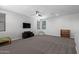 Large bonus room featuring neutral paint, carpet flooring, and a ceiling fan for ample recreational space at 8737 E Nichols Ave, Mesa, AZ 85209