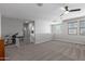 This large bonus room features neutral walls, carpeted floors, and natural light at 8737 E Nichols Ave, Mesa, AZ 85209