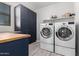 Laundry room with washer, dryer, storage cabinets, and countertop at 8737 E Nichols Ave, Mesa, AZ 85209