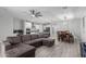 Spacious open-concept living space featuring a modern kitchen, a dining area, and a comfortable living room at 8737 E Nichols Ave, Mesa, AZ 85209